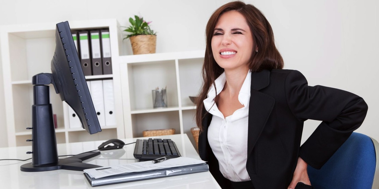 a woman sitting at a desk